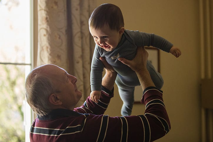 grandfather_holding_grandchild-img